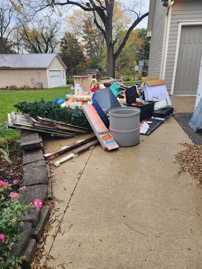 Dumpster being loaded with debris for Roofing Dumpster Rental in Hamburg